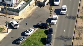 Officers investigate a deadly shooting in Southwest Philadelphia on Wednesday morning.