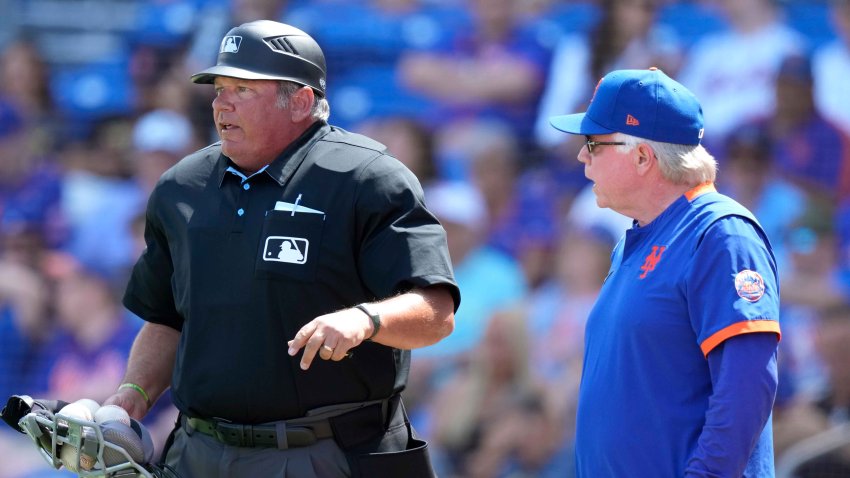New York Mets manager Buck Showalter, right, talks with home plate umpire Hunter Wendelstedt during the third inning of a spring training baseball game against the New York Mets, Tuesday, March 14, 2023, in Port St. Lucie, Fla.
