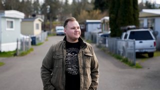 Resident and board member of the mobile home park Bob’s and Jamestown Homeowners Cooperative, Gadiel Galvez, 22, poses for a portrait in his neighborhood on Saturday, March 25, 2023, in Lakewood, Wash. When residents learned the park’s owner was looking to sell, they formed a cooperative and bought it themselves amid worries it would be redeveloped. Since becoming owners in September 2022, residents have worked together to manage and maintain the park.