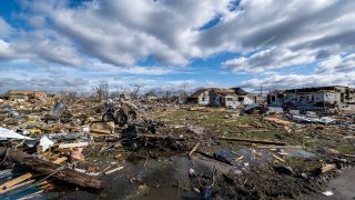 Damage from a late-night tornado is seen in Sullivan, Ind., Saturday, April 1, 2023. Multiple deaths were reported in the area following the storm. (AP Photo/Doug McSchooler)