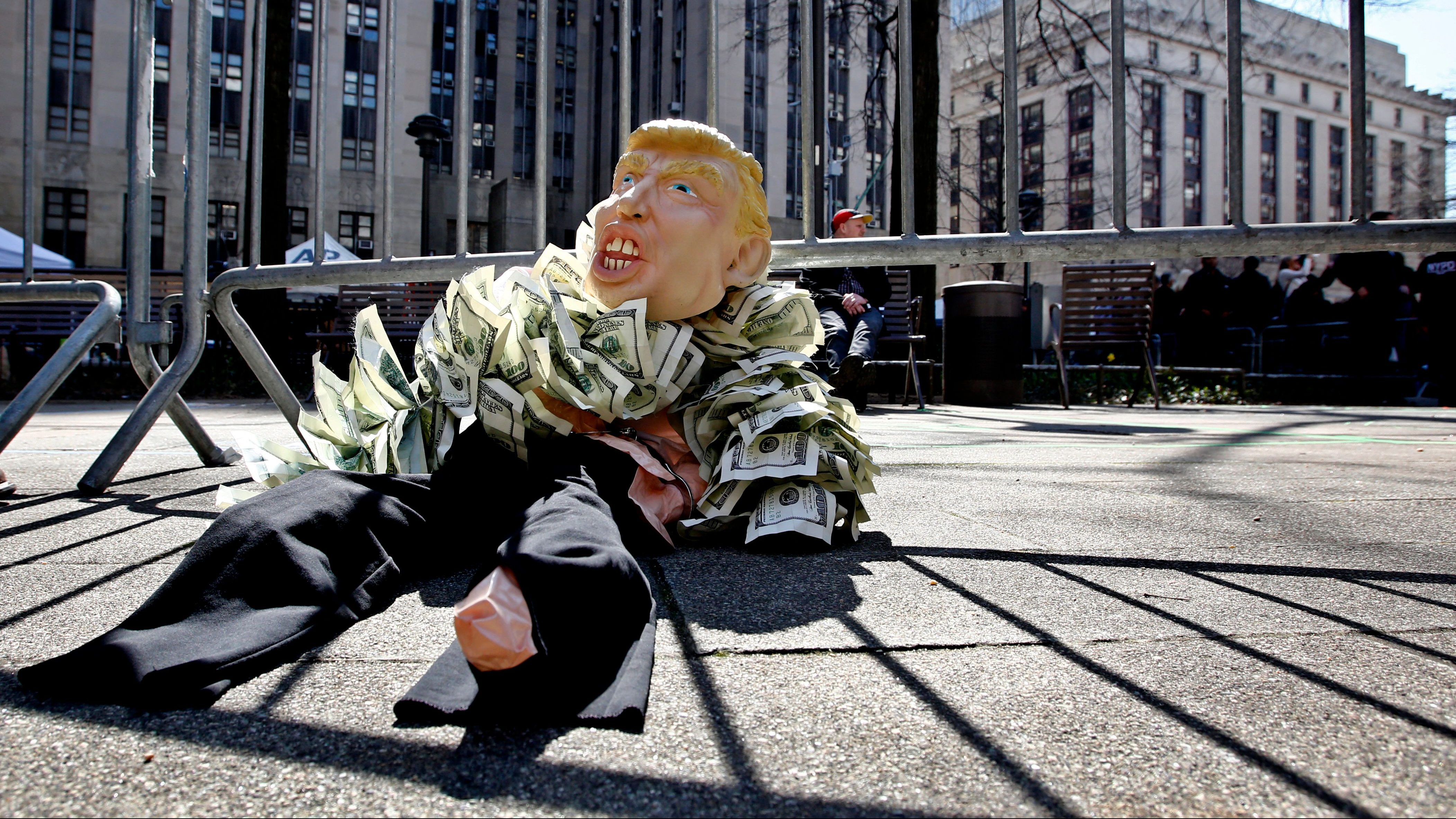 A puppet of former US president Donald Trump lies outside the Manhattan District Attorney’s office.