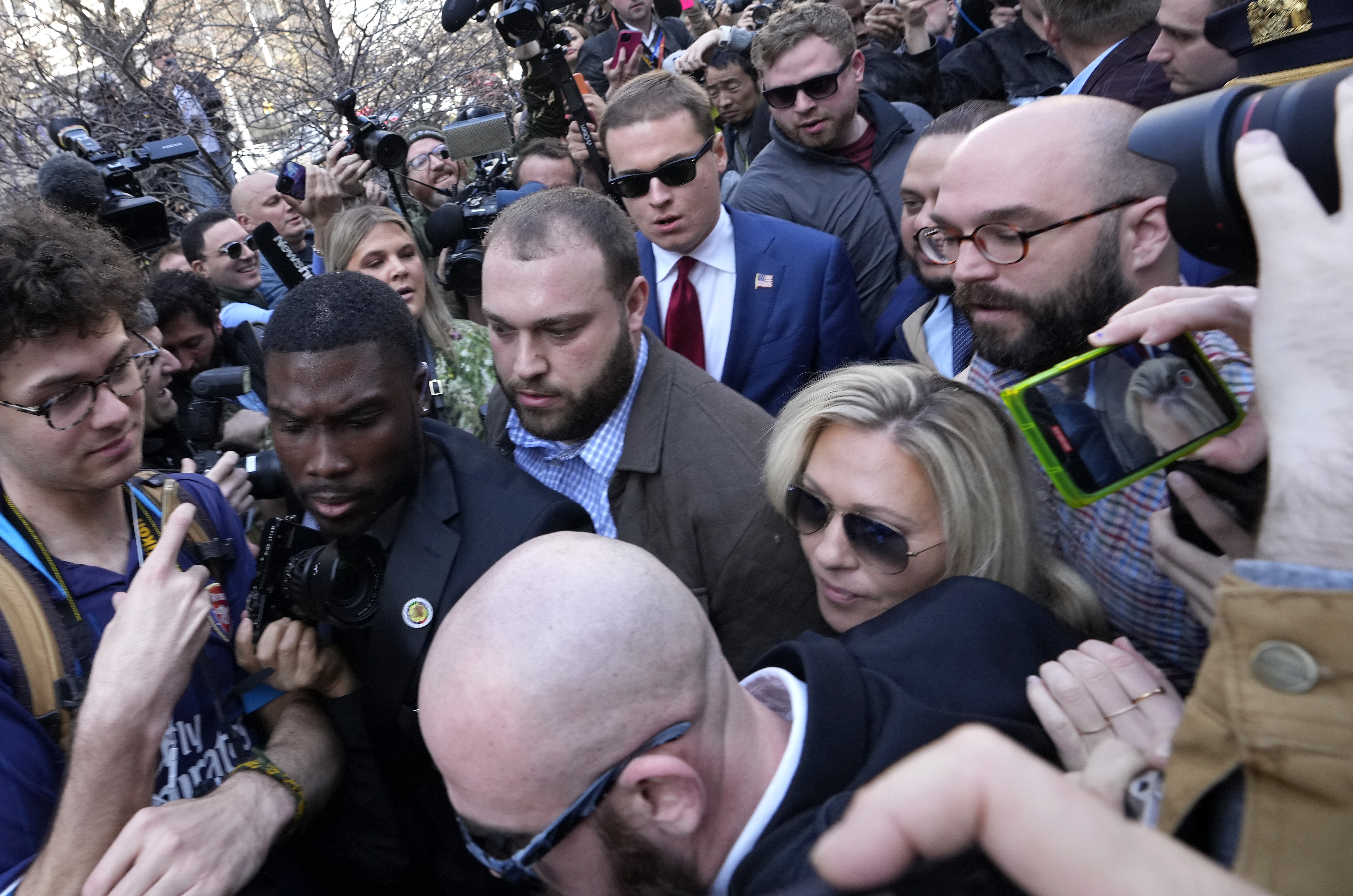 U.S. Rep. Marjorie Taylor Greene (R-GA) pushes through the crowd gathered outside the courthouse where former U.S. President Donald Trump will arrive for his arraignment on April 4, 2023, in New York City.