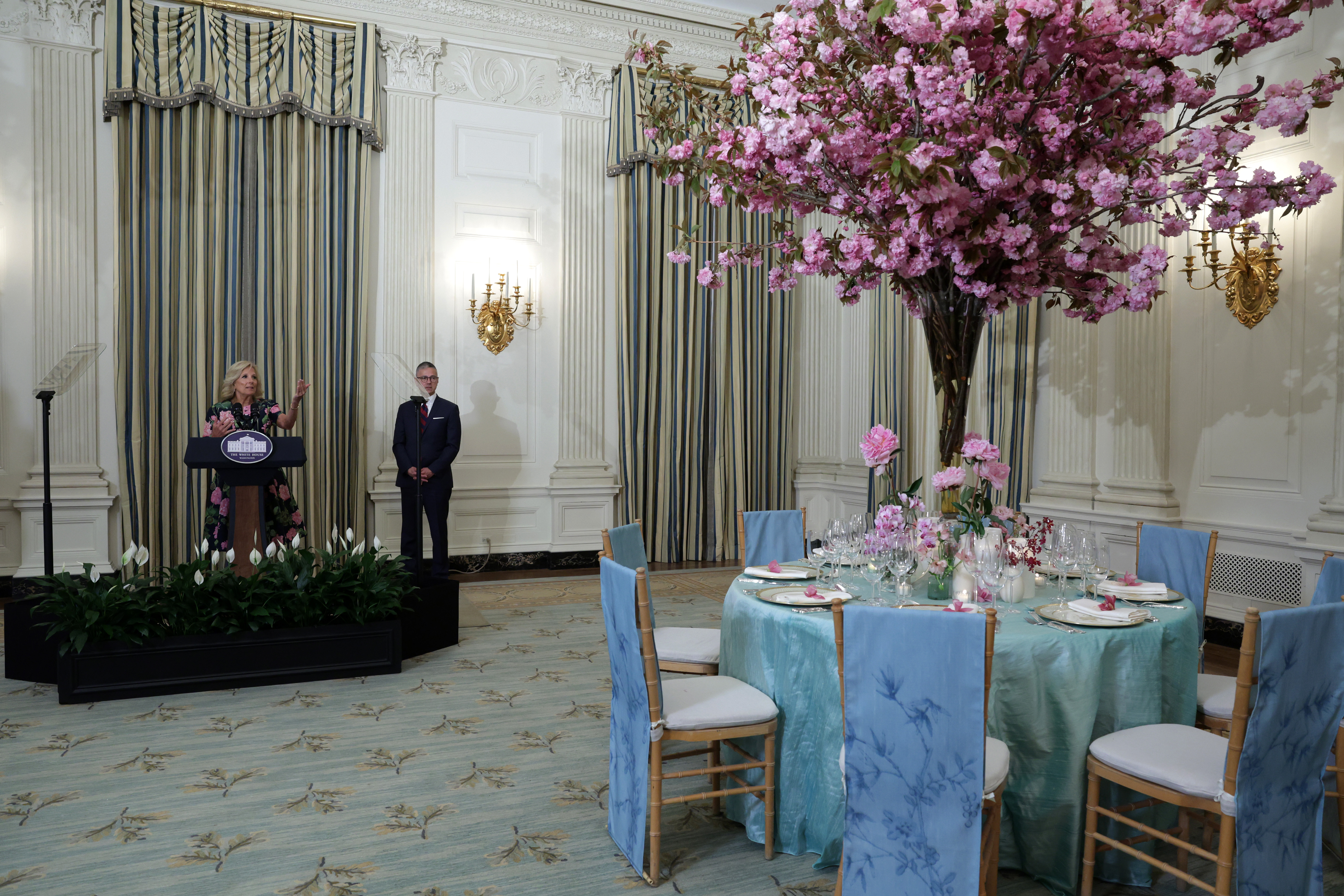 WASHINGTON, DC - APRIL 24: U.S. first lady Jill Biden speaks as White House Social Secretary Carlos Elizondo listens at a media preview of the state dinner during Wednesday's visit by South Korean President Yoon Suk Yeol and his wife Kim Keon Hee in the State Dining Room of the White House on April 24, 2023 in Washington, DC. President Joe Biden will also hold a bilateral meeting and joint news conference with President Yoon during the state visit on Wednesday. (Photo by Alex Wong/Getty Images)