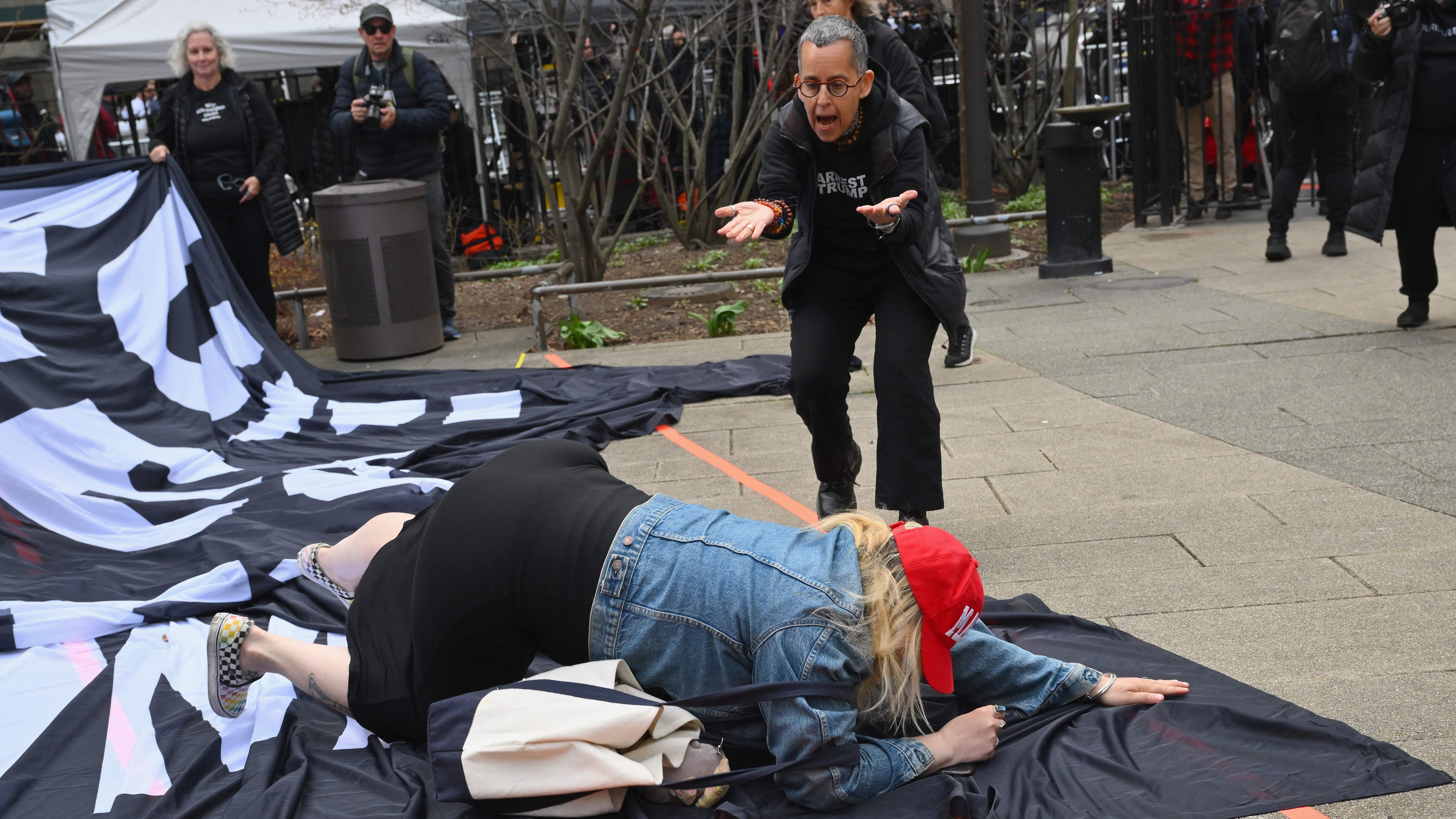 Pro and anti trump supporters argue outside of the Manhattan Criminal Court in New York City on April 4, 2023.