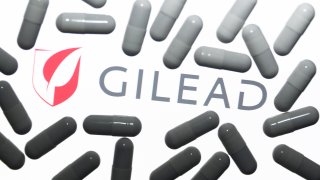 Gilead Sciences logo displayed on a laptop screen and medical pills are seen in this illustration photo taken in Krakow, Poland on October 18, 2021. (Photo by Jakub Porzycki/NurPhoto via Getty Images)