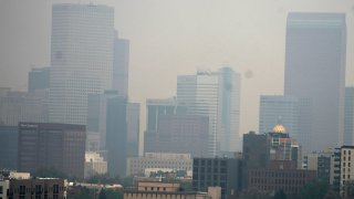 The skyline is obscured as smoke from wildfires in Alberta rolls south early Friday, May 19, 2023, in Denver.