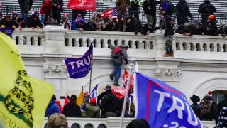 File - Trump supporters climb and surround the Capitol in Washington, D.C., on Jan. 6, 2021.
