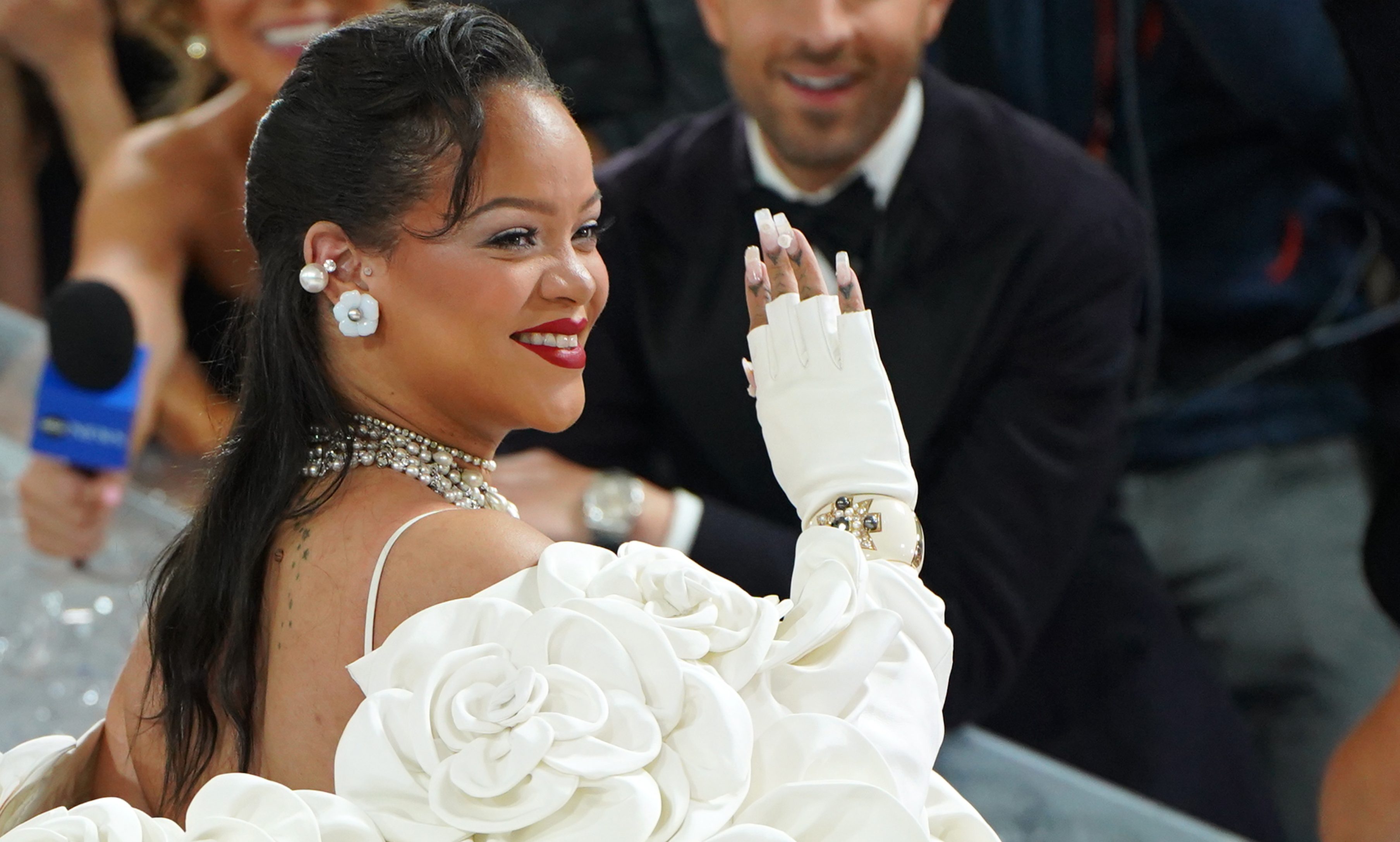 Rihanna Shows Off Baby Bump In Feathered Outfit Ahead Of The Met Gala