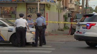 Police investigate after a shooting left a woman dead in Strawberry Mansion on Sunday morning.