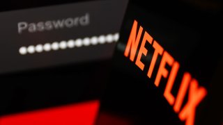 Netflix sign in page displayed on a laptop sscreen and Netflix logo displayed on a phone screen are seen in this illustration photo taken in Krakow, Poland on January 2, 2023.