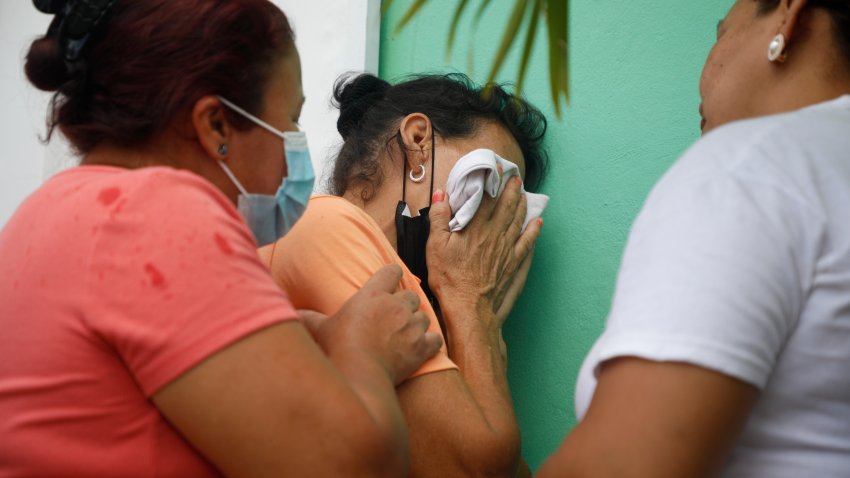 Relatives of inmates wait in distress outside the entrance to the women’s prison in Tamara, on the outskirts of Tegucigalpa, Honduras, Tuesday, June 20, 2023. A riot at the women’s prison has left at least 41 inmates dead, most of them burned to death, a Honduran police official said.