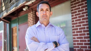 Eugene DePasquale with his arms folded