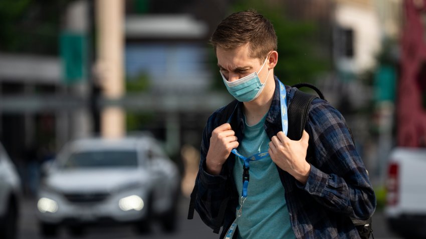 WASHINGTON, DC – JUNE 9: A man wears a face mask during the morning commute due to a code orange air quality alert because of smoke from Canadian wildfires on June 9, 2023 in Washington, DC. Compared to earlier in there week, the air quality is much improved on Friday in the Washington DC region and is forecasted to dissipate this weekend. (Photo by Drew Angerer/Getty Images)