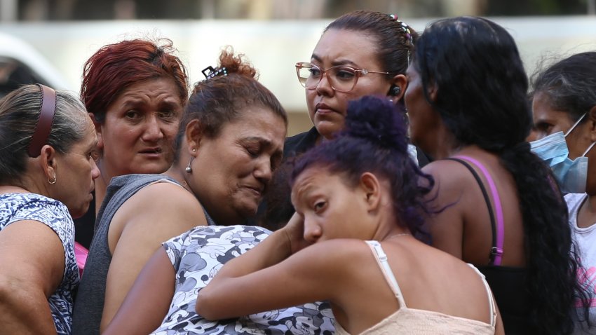 TEGUCIGALPA, HONDURAS – JUNE 20: Relatives hug each other as they await the bodies of loved ones who were killed at a women’s prison in Tegucigalpa, Honduras, on June 20, 2023. At least 41 inmates were killed on Tuesday at a women’s prison northwest of Honduras’ capital Tegucigalpa, said the Honduran Public Prosecutor’s Office. (Photo by Emilio Flores/Anadolu Agency via Getty Images)