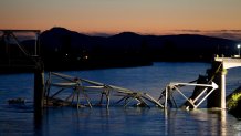 MT. VERNON, WASHINGTON  - MAY 23: A boat cruises past the scene of a bridge collapse on Interstate 5 on May 23, 2013 near Mt. Vernon, Washington. 1-5 connects Seattle, Washington to Vancouver, B.C., Canada. No deaths have been reported, and three people were taken to hospitals with injuries. (Stephen Brashear/Getty Images)