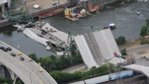 An aerial view shows the collapsed I-35W bridge 04 August 2007 in Minneapolis, Minnesota. Five people have been confirmed dead and 8 others missing following the 01 August bridge collapse during rush hour.      AFP PHOTO/Mandel NGAN (Photo credit should read MANDEL NGAN/AFP via Getty Images)