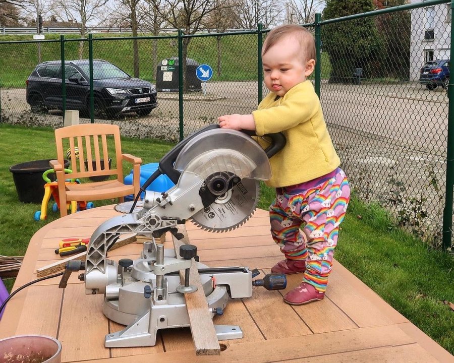 A photoshopped image of Alix operating a table saw.