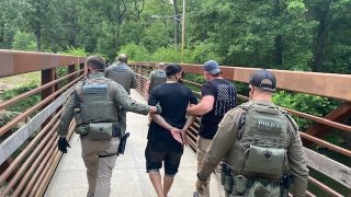 Officers with the U.S. Marshal's Fugitive Task Force arrest Ivan Claudio Rosero, who was sought in the slaying of three people in Lebanon, Pa.