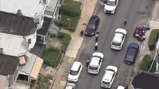 Law enforcement officials investigate after a teen girl was shot in the face in West Philadelphia on Monday.
