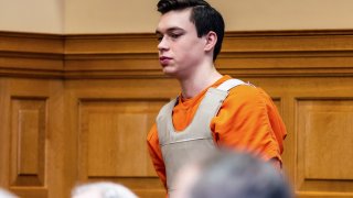 Willard Miller is led into a courtroom, March 29, 2023, in Fairfield, Iowa, for a hearing related to the murder charge he faces in the 2021 death of Fairfield, Iowa, Spanish teacher Nohema Graber.