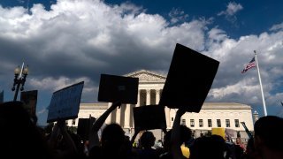 FILE – Abortion-rights activists protest outside the Supreme Court in Washington, Saturday, June 25, 2022.