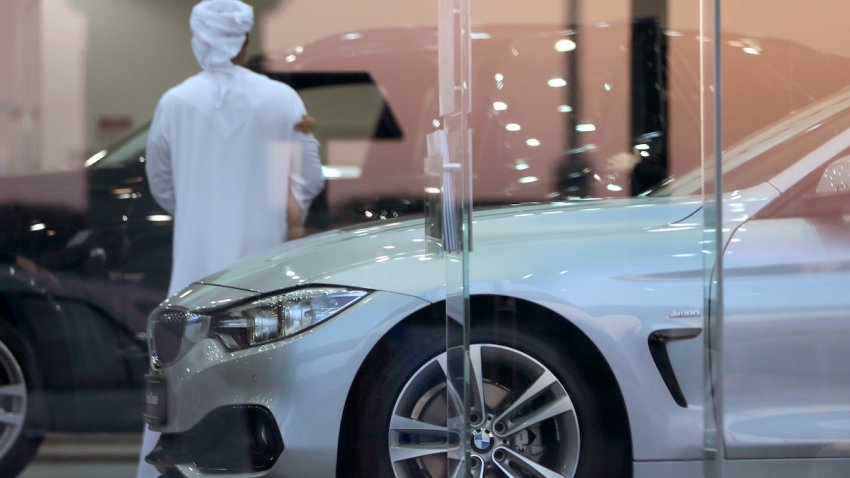 FILE – A man visits a car showroom in Dubai, United Arab Emirates, Thursday, June 2, 2016. A popular online influencer has been arrested in Dubai over a satirical TikTok video in which he portrays a brash Emirati on a spending spree inside a luxury car showroom.