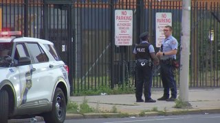 Officers investigate after a man was shot on Spring Garden Street early Sunday.