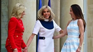 France’s first lady Brigitte Macron (C) greets US First Lady Jill Biden and her daughter Ashley Biden (R) as they meet at the Elysee Presidential Palace on July 25, 2023 in Paris, France.