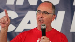 UAW President Shawn Fain addresses union members during a Solidarity Sunday rally in Warren, Michigan, Aug. 20, 2023