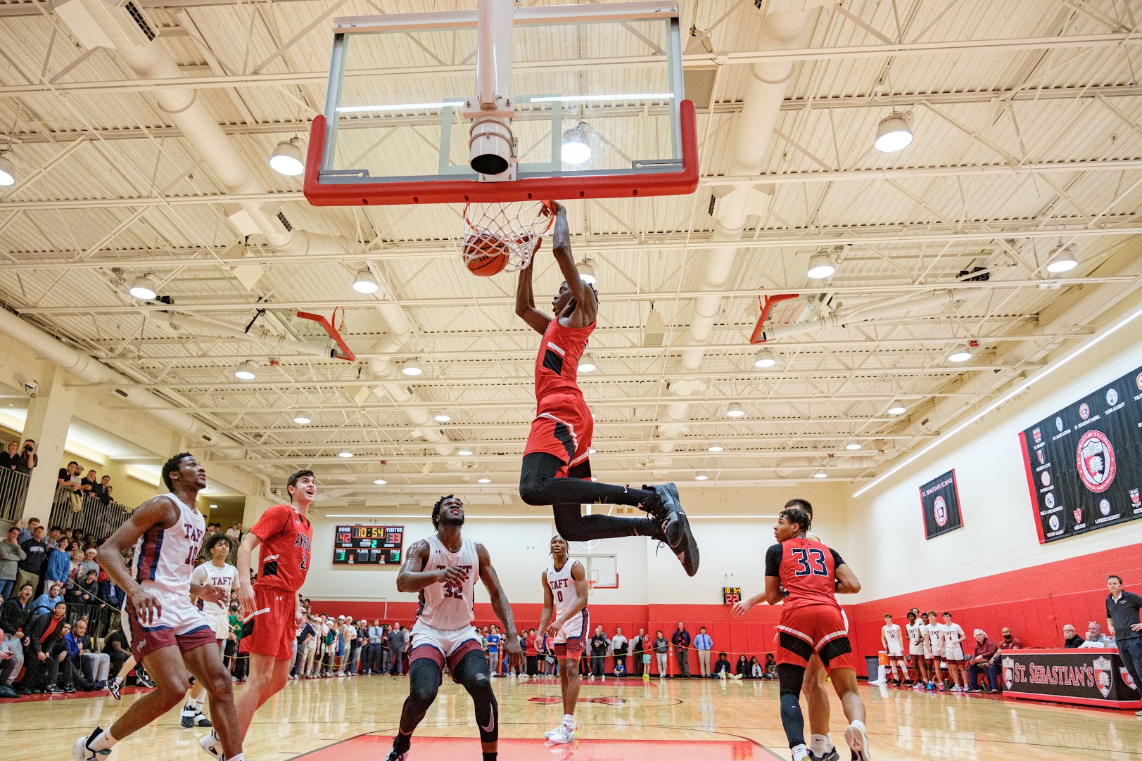 AJ Dybantsa, playing for St. Sebastian's, makes a dunk during a game against Taft, Dec. 15, 2022.