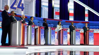 Republican presidential candidates, from left, former Arkansas Gov. Asa Hutchinson, former New Jersey Gov. Chris Christie, former Vice President Mike Pence, Florida Gov. Ron DeSantis, businessman Vivek Ramaswamy, former U.N. Ambassador Nikki Haley, Sen. Tim Scott, R-S.C., and North Dakota Gov. Doug Burgum stand on stage before a Republican presidential primary debate hosted by FOX News Channel Wednesday, Aug. 23, 2023, in Milwaukee.