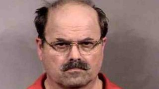 FILE - In this handout image provided by the Sedgwick County Sheriff's office, BTK murder suspect Dennis Rader stands for a mug shot released Feb. 27, 2005, in Sedgwick County, Kansas.