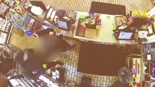 Surveillance image of Roxborough 7-Eleven being robbed