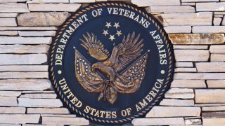 The seal of the United States Department of Veterans Affairs at the entrance to the Santa Fe National Cemetery in Santa Fe, New Mexico.