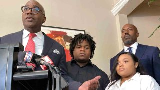 Attorney Roderick Edmond, from left, joined by Treveon Isaiah Taylor, Sr., Jessica Ross and attorney Cory Lynch, speaks during a news conference, Wednesday, Aug. 9, 2023, in Atlanta, announcing a lawsuit against a doctor and Southern Regional Medical Center, a hospital south of Atlanta where Ross went on July 9 to have her son. A doctor used too much force and decapitated Ross’s baby during delivery according to the lawsuit filed Wednesday, the attorneys said.