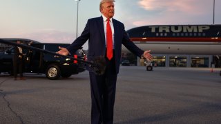 Former President Donald Trump speaks to the media at Hartsfield-Jackson Atlanta International Airport after surrendering at the Fulton County Jail in Atlanta, Aug. 24, 2023.