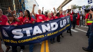 UAW President Shawn Fain marches with UAW members through downtown Detroit  after a rally in support of United Auto Workers members as they strike the Big Three auto makers on September 15, 2023 in Detroit, Michigan. 