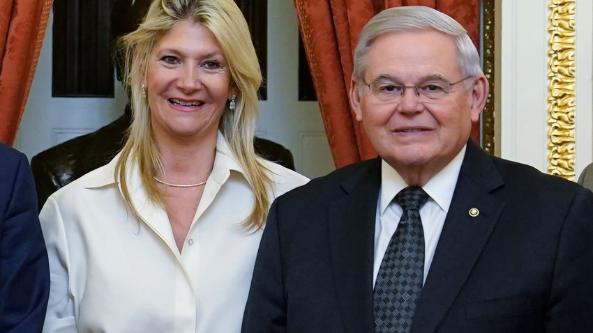 FILE - Senate Foreign Relations Committee Chairman, Sen. Bob Menendez, D-N.J., right, and his wife Nadine Arslanian, pose for a photo on Capitol Hill in Washington, Dec. 20, 2022. U.S. Sen. Bob Menendez of New Jersey and his wife have been indicted on charges of bribery. Federal prosecutors on Friday announced the charges against the 69-year-old Democrat nearly six years after an earlier criminal case against him ended with a deadlocked jury.