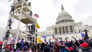 FILE - Donald Trump supporters breach the U.S. Capitol in Washington, Jan. 6, 2021.