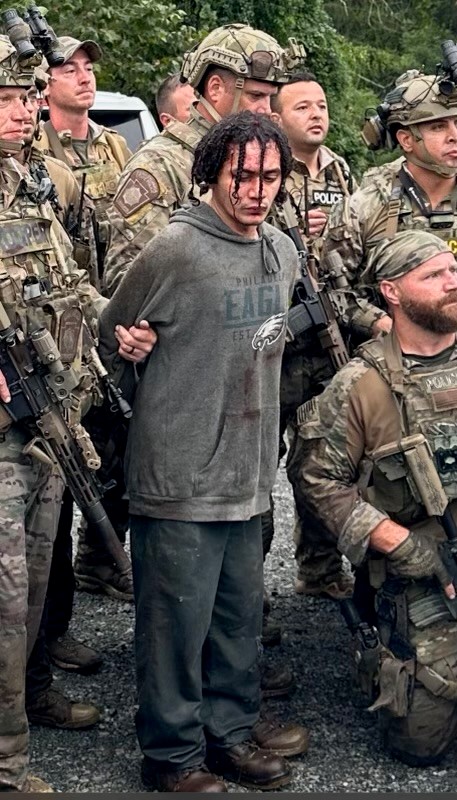 Heavily armed law enforcement officers move along Rt. 52 as the search  continues for Danilo Cavalcante in Pocopson Township, Pa., on Sunday, Sept.  3, 2023. Cavalcante escaped from the Chester County Prison.