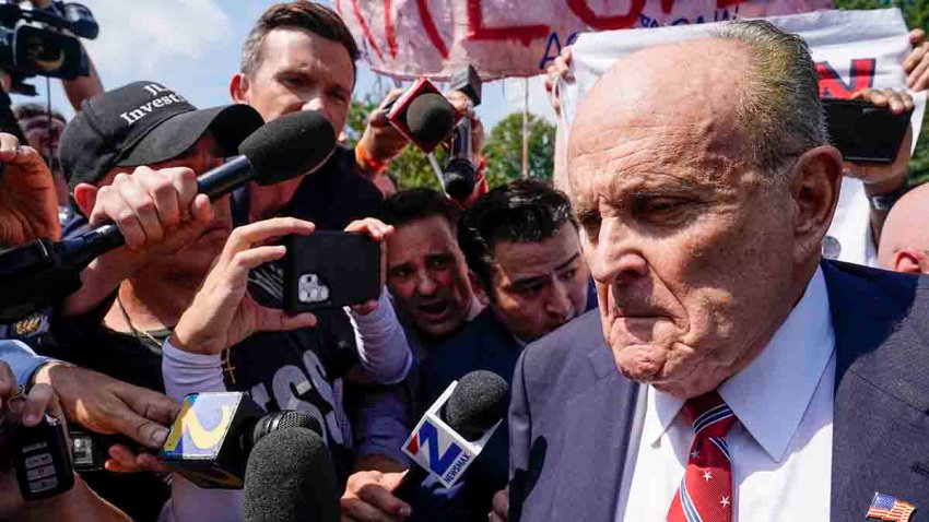 FILE - Rudy Giuliani speaks outside the Fulton County jail, Aug. 23, 2023, in Atlanta.