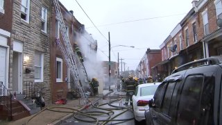 Fire crews respond to a burning building on Braddock Street in Kensington, early Monday.