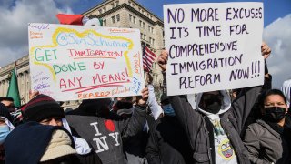 Demonstrators call for immigration reform near the White House on Feb. 14, 2022.