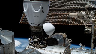 SpaceX’s Crew Dragon capsule, named Freedom, is seen docked with the International Space Station in May 2023 during the Axiom Ax-2 mission.