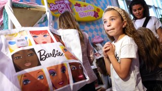 Guests shop during a visit to the Malibu Barbie Cafe pop-up in New York City on May 17, 2023.