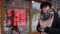 Russian ruble weakens past symbolic threshold of 100 against the dollar