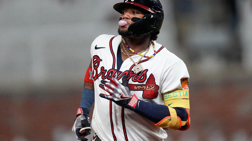 Atlanta Braves’ Ronald Acuna Jr. (13) blows a bubble as he runs the bases after hitting a two-run home run in the seventh inning of a baseball game against the Chicago Cubs, Tuesday, Sept. 26, 2023, in Atlanta.