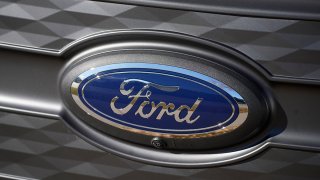 FILE - The Ford company logo is shown on Nov. 25, 2022, outside a Ford dealership in southeast Denver.
