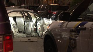 Police at the scene of a crash in North Philadelphia that left six people injured on Sunday morning.