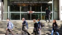 New Zealand dollar jumps 1% as central bank holds rates, warns of more hikes